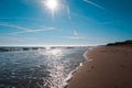 sandy beach of the Bolearic sea with beautiful waves against the background of a sunny sky Royalty Free Stock Photo