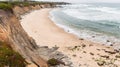 Sandy beach on a cloudy day on the Pacific Ocean coastline, Pescadero State Beach, California Royalty Free Stock Photo