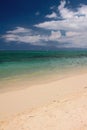 Sandy beach on coast of ocean. Trou aux Biches, Mauritius Royalty Free Stock Photo