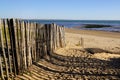 Sandy beach fence pathway to protect dune and access water sea Royalty Free Stock Photo