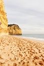 Footprints on sandy Portuguese beach Royalty Free Stock Photo