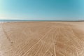 Sandy beach, footprints on the wet sand Royalty Free Stock Photo