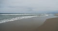 Sandy beach with gentle waves, Pacific Ocean