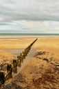 Sandy beach and groyne Royalty Free Stock Photo