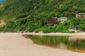 Sandy beach with houses on mountain in Brazil Royalty Free Stock Photo