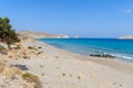 Sandy beach and lagoon with clear blue water at Crete island near Sitia town, Greece. Royalty Free Stock Photo