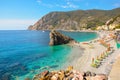 The sandy beach and large boulder rock of Monterosso al Mare, Cinque Terre, Italy Royalty Free Stock Photo