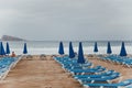 beach of Levante in Benidorm Spain in the velvet season, cloudy weather, a storm at sea, blue sunbeds 1