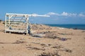 Sandy beach with a lot of garbage on the shore. Ecological catastrophy Royalty Free Stock Photo