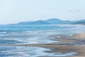 Sandy beach at low tide in Cannon Beach, Oregon at the Pacific Ocean. Sunny day Royalty Free Stock Photo