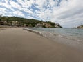 Sandy beach landscape of Meditteranean sea coast and mountain background in Port de Soller, Palma de Mallorca, Spain, Europe Royalty Free Stock Photo