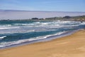 Sandy beach on the Pacific Ocean coast, California Royalty Free Stock Photo
