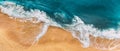 Sandy beach, panorama. Panoramic view of the sandy beach. The sea wave rolls on the shore. Sea coast view from the air. Royalty Free Stock Photo