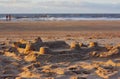 Sandy beach and panoramic view of sea coast during sunset