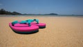 sandy beach and pink sandals Royalty Free Stock Photo