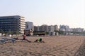 Girona, Spain, August 2018. An interesting scene on the beach in Spain, a man begs forgiveness from his wife.