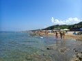 A sandy beach in San Vincenzo, Tuscany, Italy, on a sunny summer day, with people Royalty Free Stock Photo