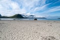 Sandy beach with sea and mountains, Lofoten, Norway