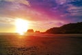 Sandy beach and soap-bubbles. Sunset in Westport, New Zealand.