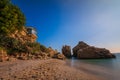 Beach in Nerja with Balcon Europa and rocks in the sea