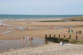 The sandy beach of St Bees, West England. People enjoy the sunny day