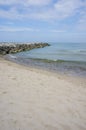 Sandy Beach with stone pier at the seaside in Jaroslawiec, Poland. Royalty Free Stock Photo