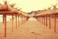 Sandy beach sunbeds umbrellas
