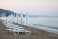 Sandy beach sunbeds umbrellas sea Royalty Free Stock Photo