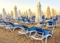 beach to sea with sun beds and folded umbrellas, Turkey, Side resort