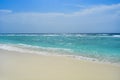 Sandy beach on a tropical island. Beautiful view with ocean and sky on sunny day Royalty Free Stock Photo