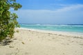 Sandy beach on a tropical island. Beautiful view with ocean and sky on sunny day Royalty Free Stock Photo