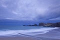 Sandy beach under cloudscape