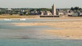 Sandy beach and village of Portbail in Normandy France