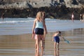 FAMILY WALKING ON THE SAND AT NEWQUAY CORNWALL FISTRAL BEACH Royalty Free Stock Photo