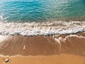 Sandy beach and waves, close-up. Texture of sand and water. Pict Royalty Free Stock Photo