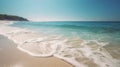 a sandy beach with waves coming in to shore and a cliff in the distance Royalty Free Stock Photo