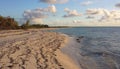 Endless sandy beach of the Caribbean sea in the sunlight of the setting sun at Cayo-Coco Cuba