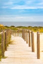 Sandy boardwalk path to the beach