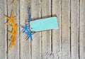 Sandy boardwalk planks background with yellow and blue starfish