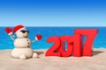 Sandy Christmas Snowman at Sunny Beach with 2017 Ney Year Sign.