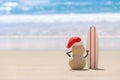 Sandy Christmas Snowman is watching the waves Royalty Free Stock Photo