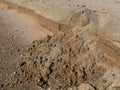 Sandy cliff. Small sandy wall.