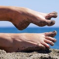 Sandy crazy woman toes on the beach Royalty Free Stock Photo