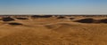 Sandy dunes on the horizon of the Sahara desert of Tunisia Royalty Free Stock Photo