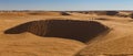 Sandy dunes on the horizon of the Sahara desert of Tunisia Royalty Free Stock Photo