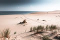 Sandy dunes on the shore of sea bay. Footprints on the sand Royalty Free Stock Photo