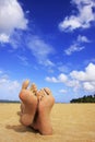 Sandy feet on a beach Royalty Free Stock Photo