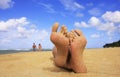 Sandy feet on a beach Royalty Free Stock Photo