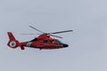 Red Coast Guard Helicopter patrols the area