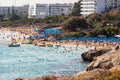 Sandy Mediterranean beach with turquoise water and vacationers. Glyki Nero and Pantachou Beach, Ayia Napa, Cyprus - 20 Oct 2023